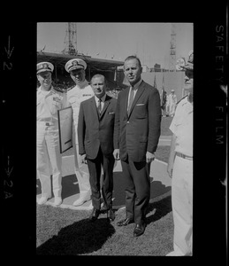 Two unidentified men and three unidentified Naval officers participating in ceremony at Fenway Park