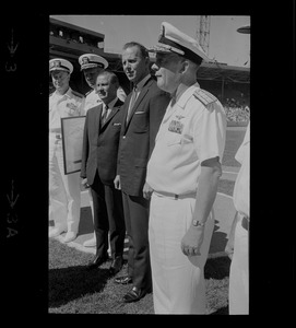 Two unidentified men and three unidentified Naval officers participating in ceremony at Fenway Park