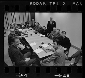 Unidentified men around a conference table in Boston City Hall
