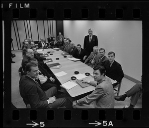 Unidentified men around a conference table in Boston City Hall