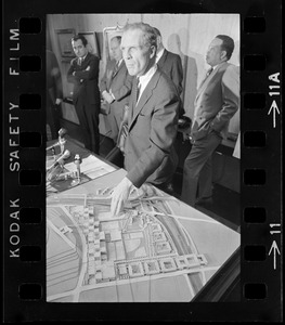 Boston Mayor Kevin H. White overlooks the scale model of proposed 129-acre high school to be constructed in the Madison Park area of lower Roxbury