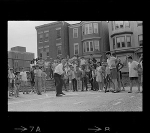 Mayor Kevin White takes his turn at bat during walking tour of East Boston prior to dedication of first neighborhood city hall