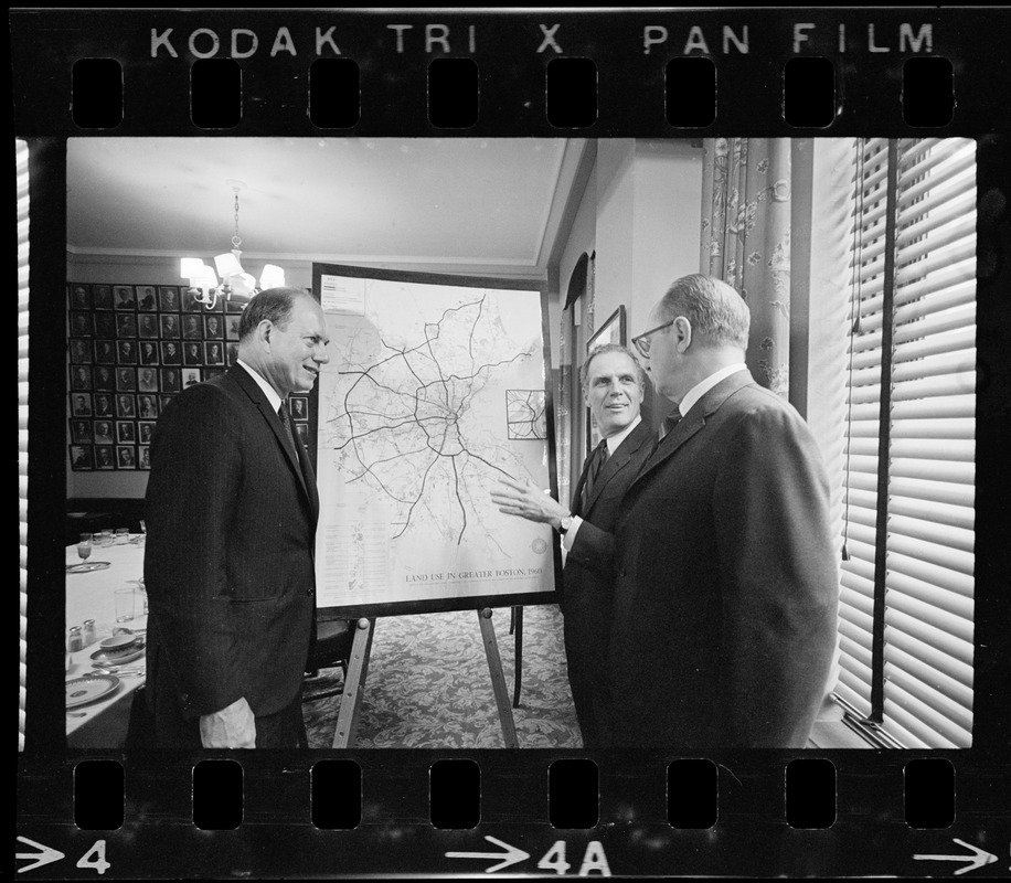 Boston Mayor Kevin White, flanked by two unidentified men, with Boston land use map