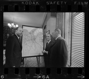 Boston Mayor Kevin White, flanked by two unidentified men, with Boston land use map