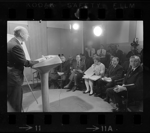 Professor Albert M. Sacks speaking at meeting of Home Rule Commission as Father Thomas J. Fleming, City Councilor John Saltonstall, Faye Siegfriedt, Rep. I. Edward Serlin, and Patrick McDonough watch