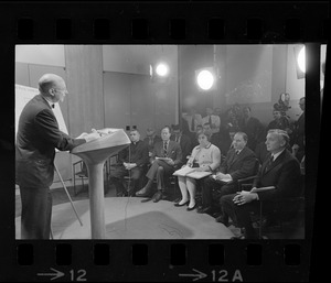 Professor Albert M. Sacks speaking at meeting of Home Rule Commission as Father Thomas J. Fleming, City Councilor John Saltonstall, Faye Siegfriedt, Rep. I. Edward Serlin, and Patrick McDonough watch