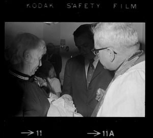Godparents Richard Dray and Mrs. Lawrence Cameron, with godchild Patricia Hagan White at her christening in the home of Boston Mayor Kevin White