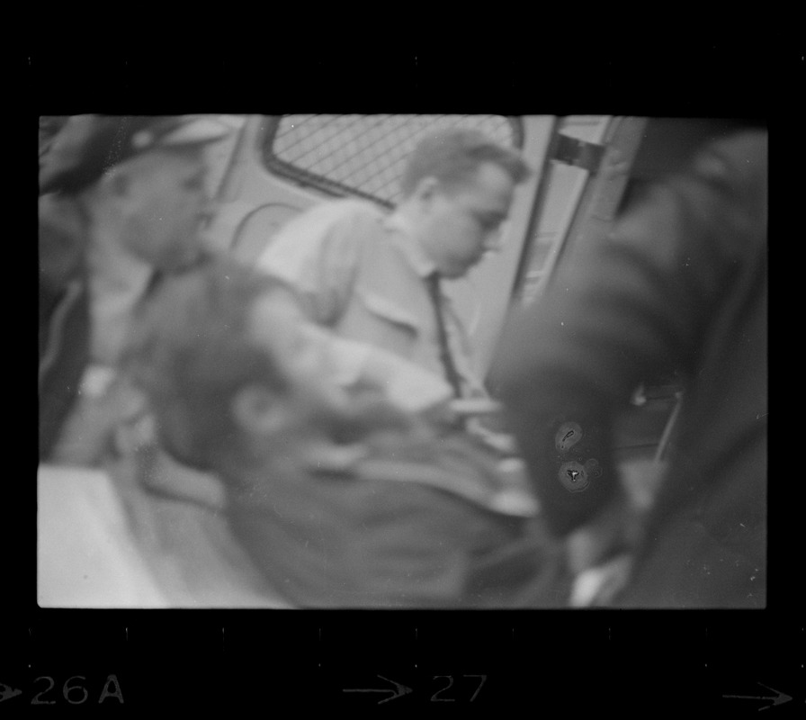 Robert Barry being loaded into an ambulance after breaking ankles during attempt to escape Charles Street Jail