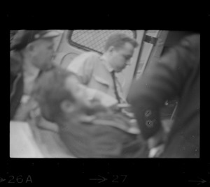 Robert Barry being loaded into an ambulance after breaking ankles during attempt to escape Charles Street Jail