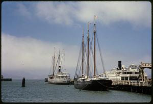 "Eureka" ferryboat and other boats docked at pier, San Francisco Maritime Museum