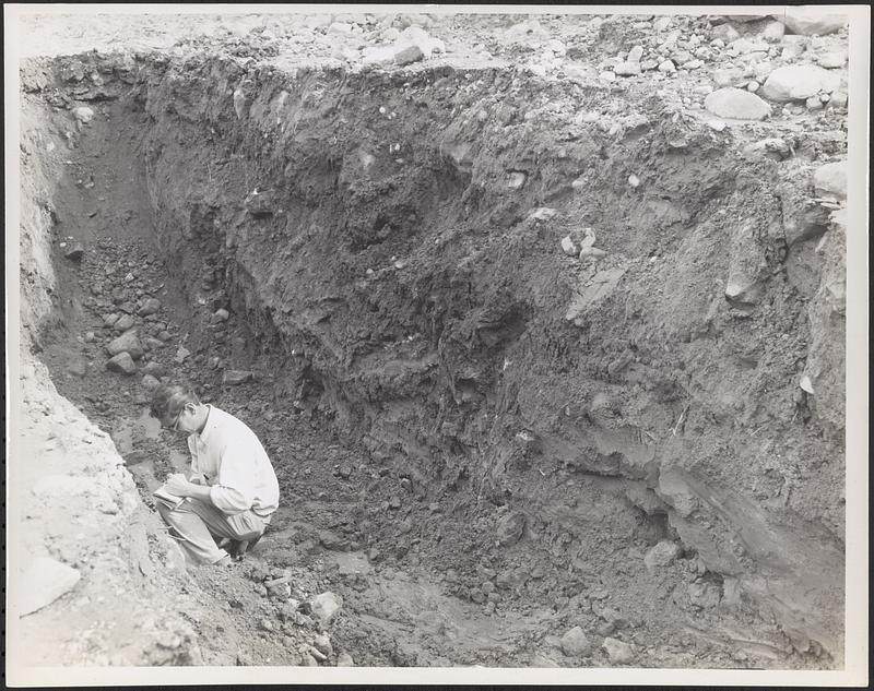 Right wall of pit showing sandy material, engineer taking notes