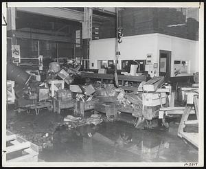 Reed-Prentice’s shipping department was a shambles after four feet of flood water receded.