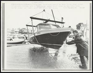 Residents hurry to take boats from water at Hyannis Marina 9/9 as hurricane Gerda bears down on the area with heavy rains and winds near 100 miles per hour.