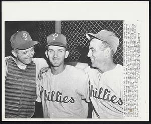 Lead Phils to Victory -- Catchers Stan Lopata (left) and third baseman Granny Hamner (right), who drove in seven runs between them in the Philadelphia Phillies 8-3 win over Los Angeles last night, are pictured after the game with rookie righthander Ray Semproch, who pitched the win, his third. Lopata bashed a single and homer and Hamner drove in five runs with a bases-loaded triple and the 100th home run of his career. Semproch set down the Dodgers with five hits.