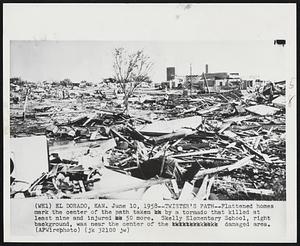 Twister's Path--Flattened home mark the center of the path taken by a tornado that killed at least nine and injured 50 more. Skelly Elementary School, right background, was near the center of the damaged area.