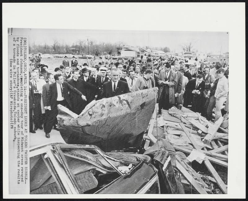 Toledo, Ohio - President Looks At Toledo Twister Rubble - President Johnson, completing a one-day tour of Midwest areas ravaged by floods and tornadoes, stands at center while inspecting the results of a tornado in Fuller's Creekside, Toledo suburb.