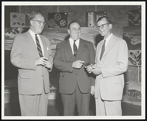 In celebration of Boston Trade Week, an exhibit of Puerto Rican products was officially reviewed at the John Hancock Mutual Life Insurance Company Building Lobby, by left to right: Mr. William H. Gulliver, Jr., Chairman of the Boston Port Commission; Richard Preston, Commissioner, Massachusetts Department of Commerce; and John Q. Adams, Assistant Treasurer of the John Hancock. The display is open to the public through Friday from 9:00 a.m. to 4:00 p.m.