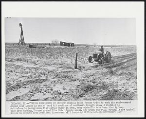 Typical Farm Scene In Drought Area--A Texas farmer tries to work his sand-covered ground near Lamesa in one of hard hit sections of southwest drought area. A windmill is motionless in background. With little water in area, many windmills have been tied to keep a from turning. Barren ground like this, tumble weeds, dry brush and still windmills are typical scenes in drought area President Eisenhower will inspect.