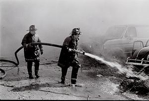 Chelsea firefighter Eddie Terciak and firefighter Bill Dudley advancing an attack line at the fire