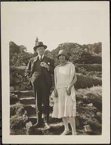 An unidentified man and woman standing steps