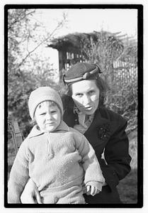 Maude Sanromá holding a child