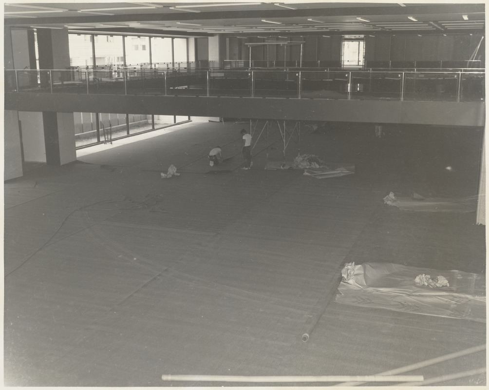 Laying carpet during Boston Public Library Johnson building construction, July 1972