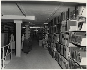 Books on shelves, Boston Public Library Johnson building construction, July 1972
