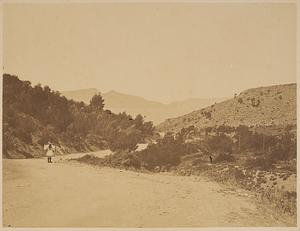View of man in traditional Greek dress on mountain road