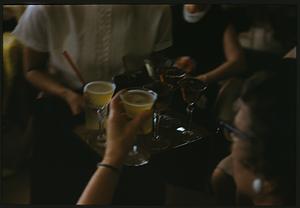 Person reaching for a beverage on tray, Swampscott, Massachusetts