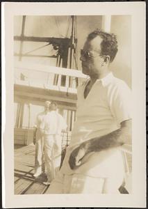 Men standing on a ship deck