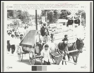 Rev. Ralph Abernathy, head of Southern Christian Leadership Conference (C), and C.B. King (L), Georgia gubernatorial candidate, sit on mule drawn wagon as protesters continue their march to Atlanta 5/20.