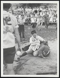 Mrs Elsie Hammond violently protests decision of umpire Carl Peledge delighting small fry Little League spectators