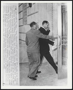 Klansmen Appear for Trial--Ku Klux Klansmen William Orville Eaton, (left), and Eugene Thomas, (right) are shown entering the federal court building here today where they go on trial for civil rights violations in connection with the slaying of Mrs. Viola Gregg Liuzzo, white Detroit, Mich., housewife. Eaton and Thomas also face state charges of murder in connection with the slaying. Collie Leroy Wilkins another Klansmen was acquitted in state court earlier of murder charges arising from the slaying.