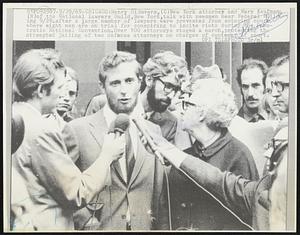 Henry DiSuvero, (C) New York attorney and Mary Kaufman (R) of the National Lawyers Guild, New York, talk with newsmen near Federal Building 9/29. after a large number of lawyers were prevented from entering court where eight men are on trial for conspiring to incite riots during the Democratic National Convention. Over 100 attorneys staged a march, protesting the attempted jailing of two defense attorneys on charges of contempt of court.