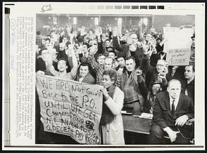 The Sign Tells Their Feelings-Members of the Branch 36 of the National Association of Letter Carriers employ signs to tell of their decision to reject their officials' advise and remain out on strike. Scene took place in an armory in New York City Saturday as 6,000 members of the unit expressed a virtual unanimous voice vote to remain out on strike.