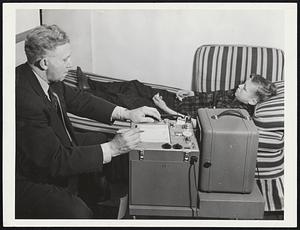 Bernard R. Highley, psychologist for the Alfred L. Willson Children's Center in Columbus, Ohio, demonstrates, with a model, how he has adapted a General Electric photoelectric recorder (right) for use with a lie detector in emotion tests to unearth hidden causes for the misbehavior of problem children. The recorder detects, and makes a permanent record, of minute changes in the electric conductivity of the skin on the palms or surface of the hands. Psychologists have long known that emotional reactions change the conductivity of this skin, but Highley says "the extreme sensitivity of the recorder reveals for the first time the true characteristics of the minute changes in skin conductance."