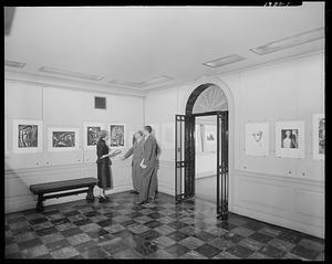 Keeper of Prints Arthur Heintzelman, center, with Muriel C. Robinson and Paul Swenson in The Wiggin Gallery, Boston Public Library