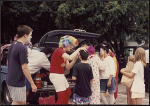 Meryl Hlynka applying clown makeup, Fourth of July celebration