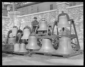 Lightship service in Chelsea, Joseph K. Robinson with lightship bells in yard