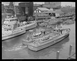 Coast Guard boats at East Boston waterfront, Ferry Ralph J. Dalumbo at its sup to left