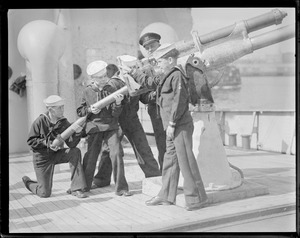 New York members of the junior naval militia, Howard Christensen, Frank Botschiller, John Horohan and Joseph Samet, assisted by Bo's'n R.S. Tewkesbury, load ammunition aboard Coast Guard cutter Dix.