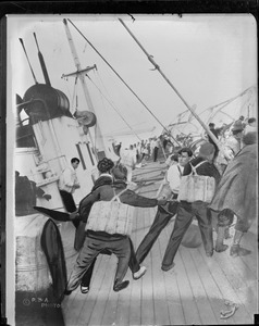 Exclusive photo of the sinking of the SS Vestris: Passengers on deck put on life Jackets as ship lists to port.
