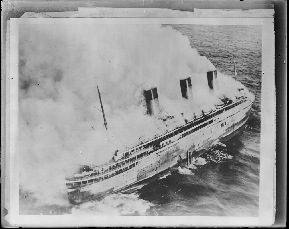 French liner SS Atlantique on fire off Guernsey, England