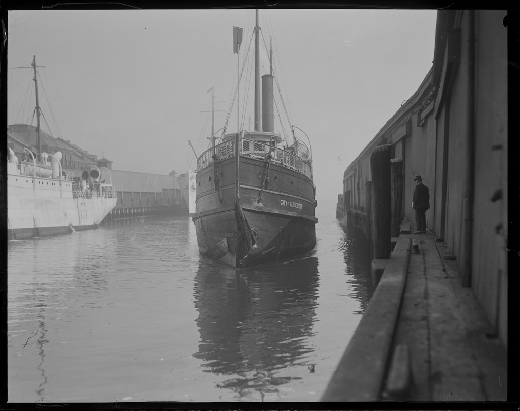 SS City of Gloucester - damaged. Atlantic Avenue waterfront - Boston. Long wharf on left, central wharf on right.