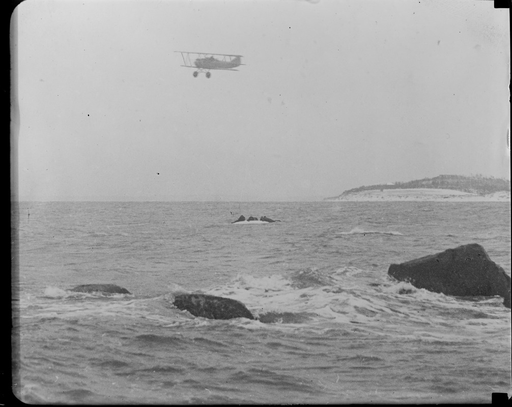 Aeroplane flying over capsized boat of the Manomet life saving crew during SS Robert E. Lee rescue