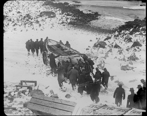 Manomet life saving crew carting surf boat to the water. Three of eight died when the boat capsized while returning from the SS Robert E. Lee.