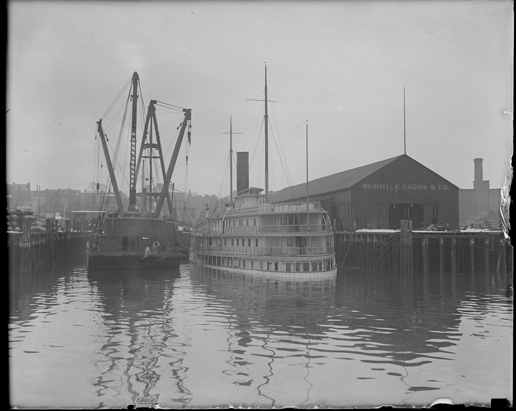 SS City of Rockland sinks at her dock in East Boston, taken at low tide