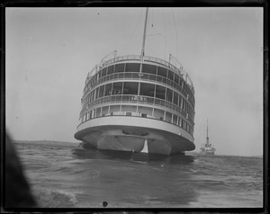 SS Commonwealth being towed to Newport after losing side wheel in storm off Point Judith