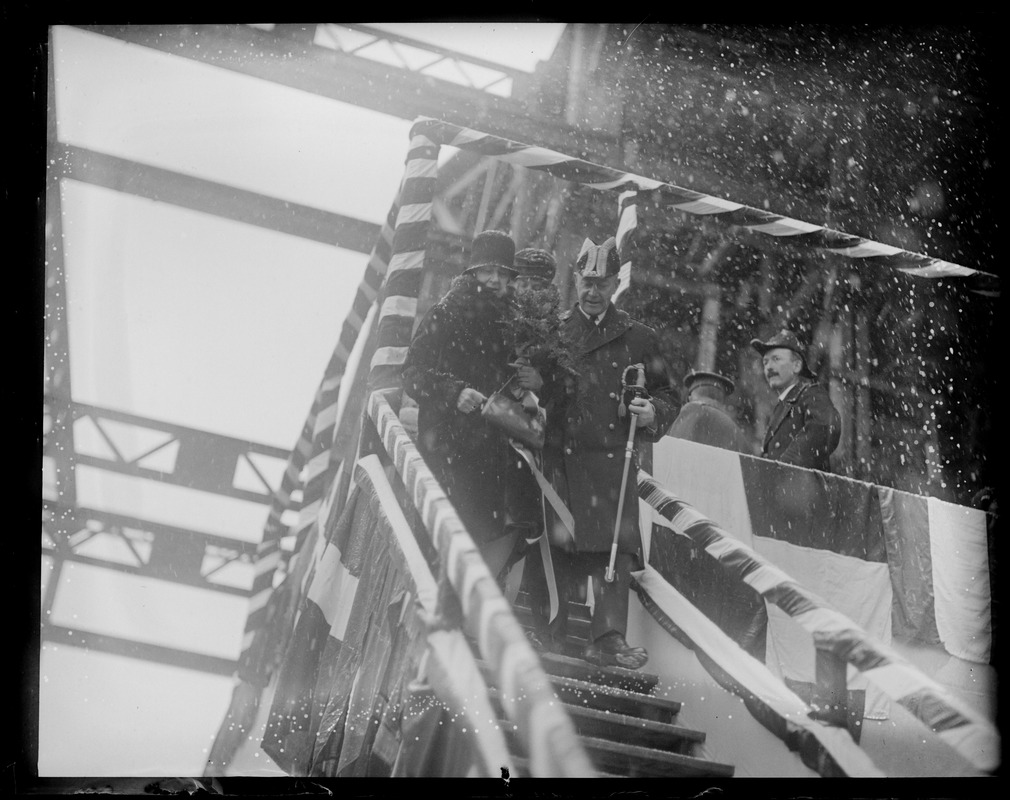 Mrs. Charles Francis Adams christens the V-5 in Portsmouth, N.H. Navy Yard during blinding snowstorm