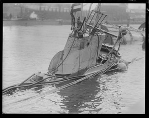 Half submerged S-4 sub after accident. Charlestown Navy Yard - Pier 4.